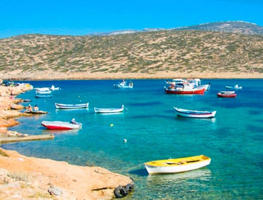 boats at the beach of greek island