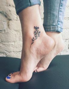 a beautiful tattoo on ankle of girl