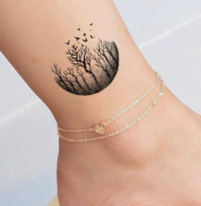 black half moon forest tattoo on ankle