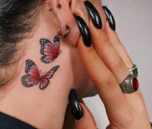 colored butterfly tattoo girl