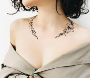 female neck delicate tattoo
