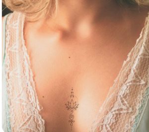 in between breast female tattoo design