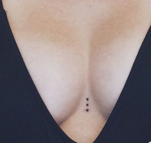 small dots in line between breast