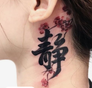 symbol tattoo design on female neck