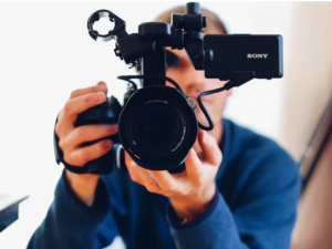 a man operating video camera