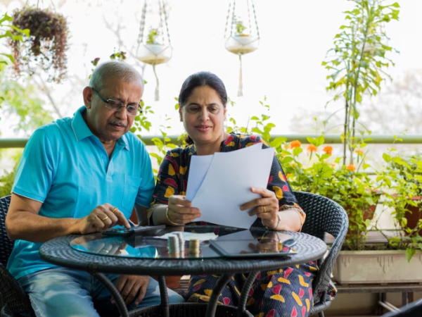 elderly couple checking health insurance plan