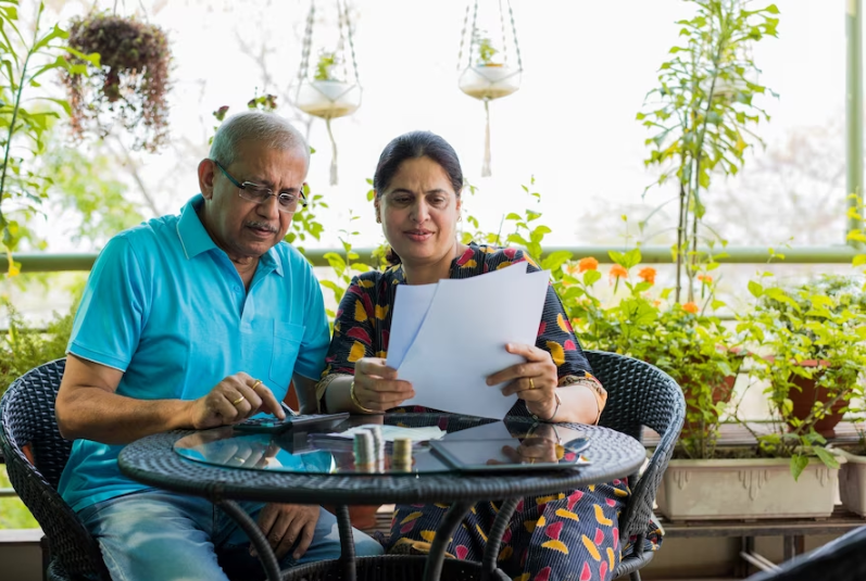 elderly couple checking health insurance plan
